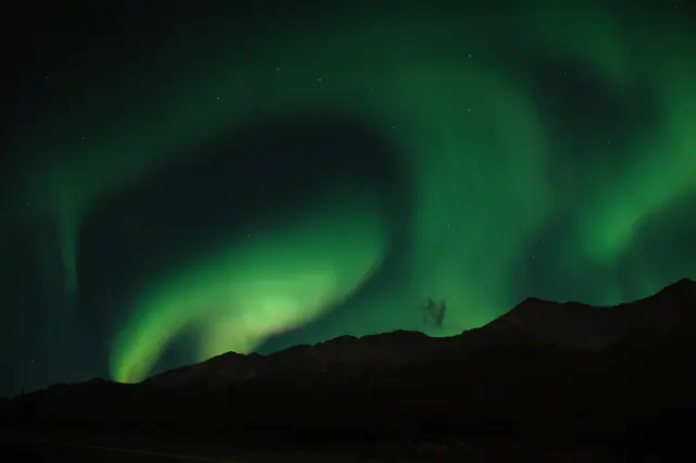 Aurora borealis in the night sky above Alaska