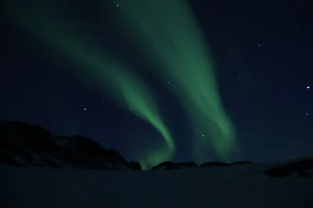 Aurora borealis in the night sky above Canada