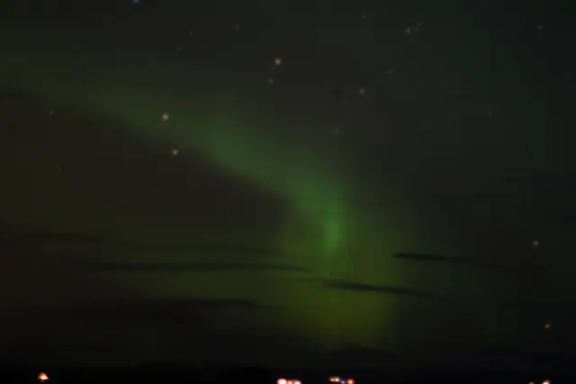 Aurora borealis in the night sky above Alaska