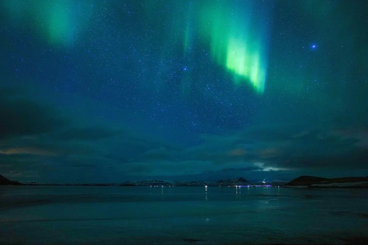Northern lights in the night sky over Lake Mývatn in northern Iceland